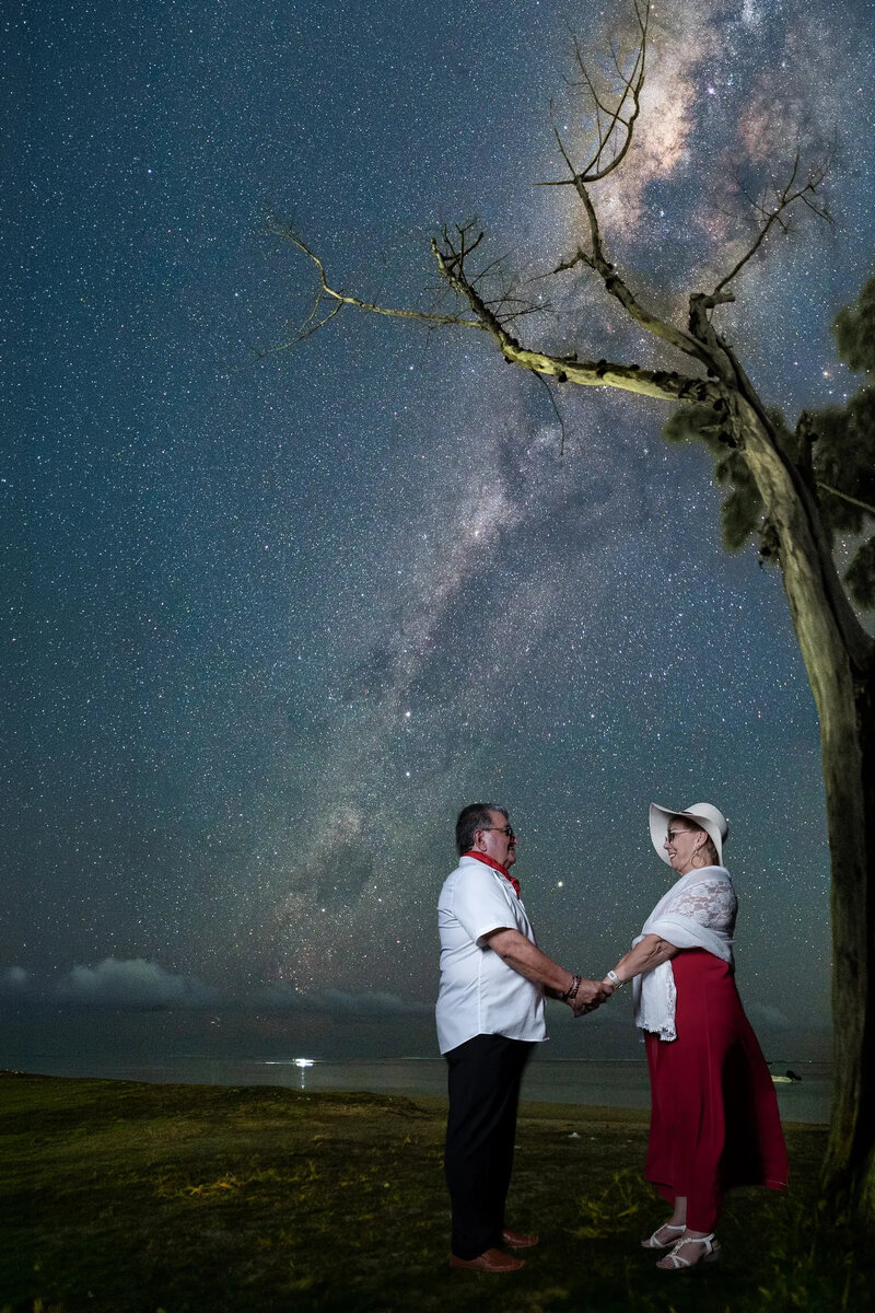 couple-holding-hands-under-milky-way.jpg