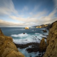 The Rocks Below And The Clouds Above