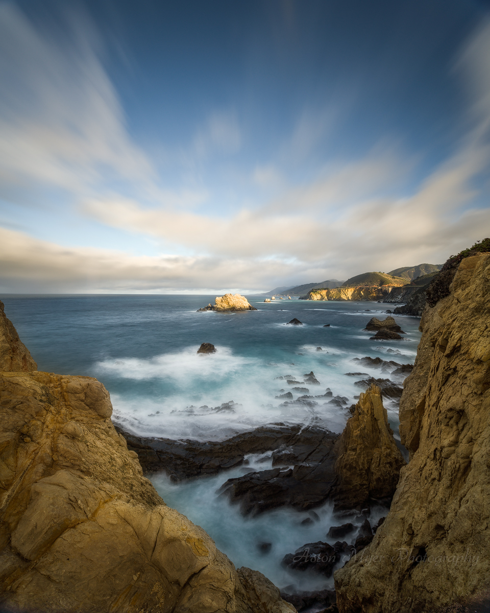The Rocks Below And The Clouds Above